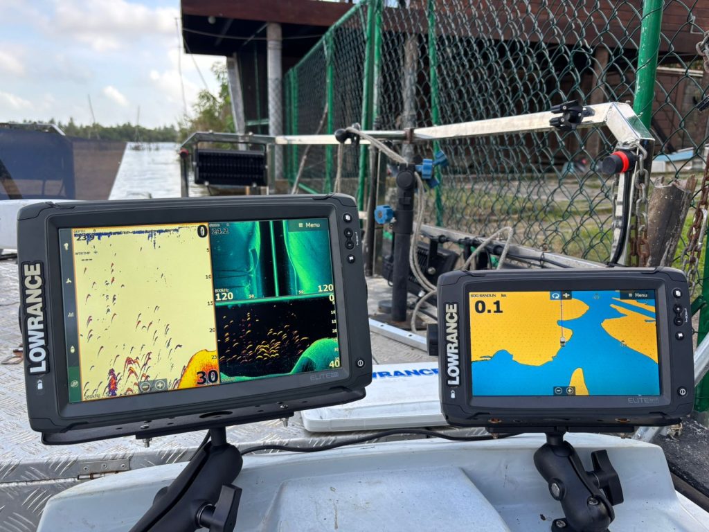 Two Lowrance Elite fish finder and GPS devices mounted on a boat.